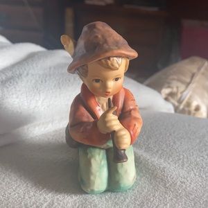 Hummel Figurine The “Little Tooter” Boy kneeling playing the flute/horn